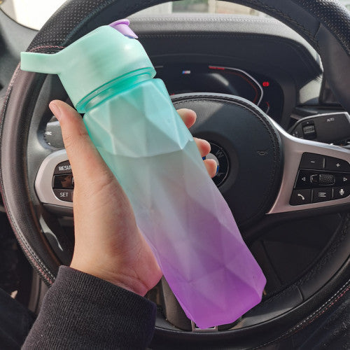 Stay refreshed on the go with this Large Capacity Spray Water Bottle. Lightweight, portable, and perfect for sports, fitness, travel, or outdoor activities.