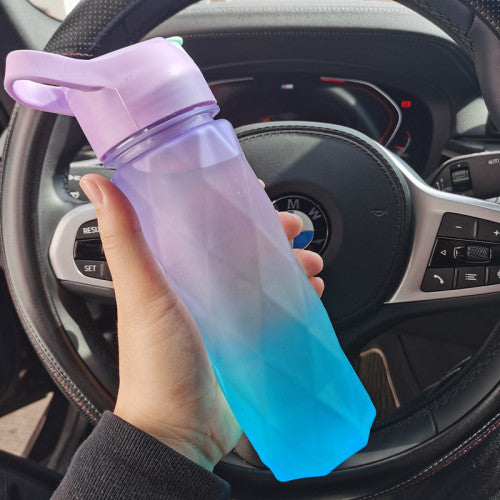 Stay refreshed on the go with this Large Capacity Spray Water Bottle. Lightweight, portable, and perfect for sports, fitness, travel, or outdoor activities.